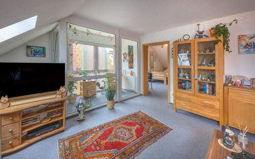 Wohnzimmer mit Wintergarten - Etagenwohnung mit 57,50 m&sup2; in Dießen am Ammersee zum Kaufen