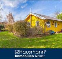 Charmantes Ferienhaus mit Kamin und großem Garten unmittelbar am Nehmser See!