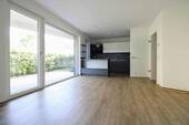 Wohnzimmer mit Blick in die Küche - 