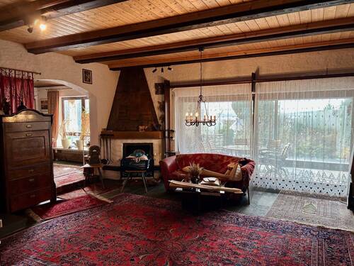 Wohnbereich mit Heizkamin und Wintergartenzugang - 6 Zimmer Einfamilienhaus zum Kaufen in Höchstadt