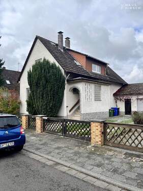 Vorderseite - 8 Zimmer Einfamilienhaus zum Kaufen in Rodgau