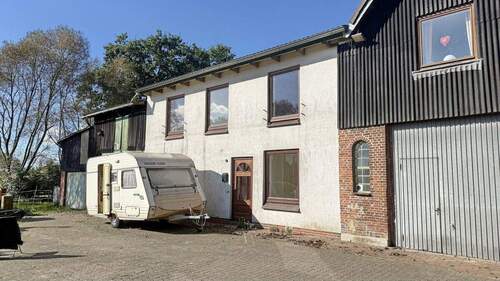 Front - Einfamilienhaus mit 141,50 m&sup2; in Wulfsmoor zum Kaufen