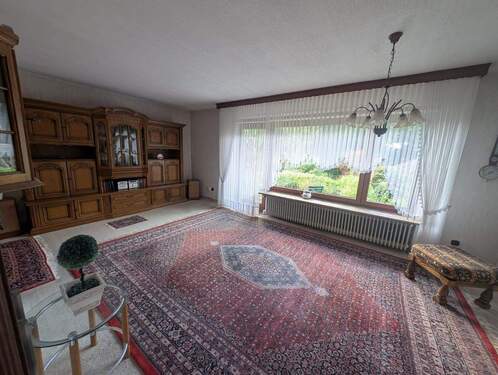 Wohnzimmer mit Zugang zur Terrasse - 