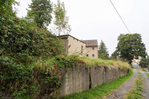 Seitliche Begrenzungsmauer - Grundstück in Steina zum Kaufen