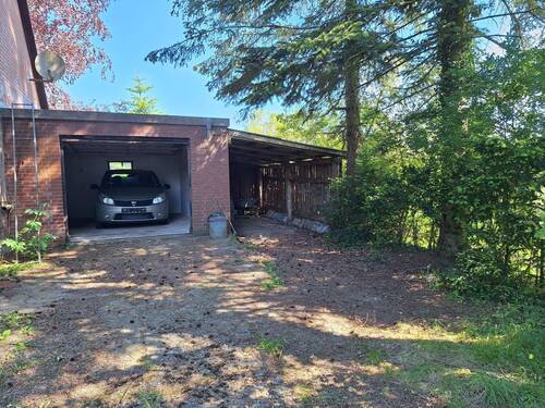 Blick auf die Garage - Einfamilienhaus mit 122,00 m² in Tolk zum Kaufen