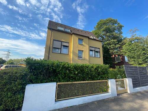 Ansicht2 - Mehrfamilienhaus mit 4 Wohnungen und 5 Garagen