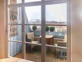 Loggia mit Ausblick über die Dächer Kiels - 
