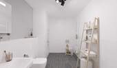 Ein modern gefliestes Badezimmer mit bodengleicher Dusche - 