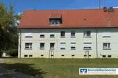 Hausansicht - Geflegte 4-Zi.-Erdgeschosswohnung mit Gartenblick, zwei Kellerräumen und Garagenoption!