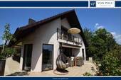 Terrassenansicht - Exklusiver Wohntraum in familienfreundlicher Lage mit idyllischem Garten!
