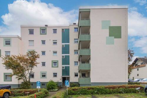 Hausansicht - Erst anpacken, dann genießen: Gestaltbare ETW mit Balkon, Tiefgaragen- und Außenstellplatz