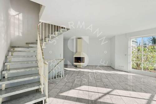 Wohnbereich mit Kamin - Doppelhaushälfte mit 136,70 m² in Düsseldorf zum Kaufen