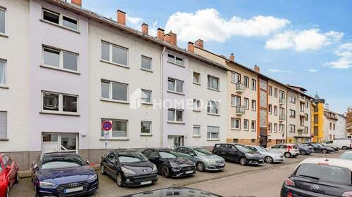 Außenansicht 1 - Gepflegte 2-Zimmer-Erdgeschosswohnung mit Südloggia in gefragter Lage von Frankfurt am Main