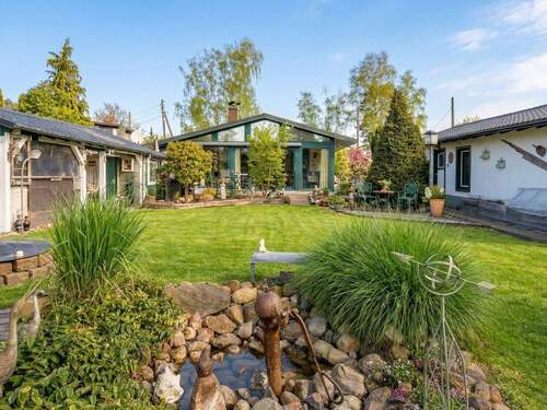 Gartenansicht - Bungalow in idyllischer Wasserlage und Privatsteg auf 869 m² Grundstück: Verkauf mit Nießbrauchrecht