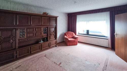 Wohnzimmer EG - Einfamilienhaus mit 120,00 m² in Ebernhahn zum Kaufen