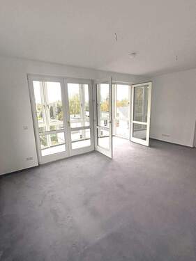 Wohnzimmer mit Zugang zum Wintergarten - 