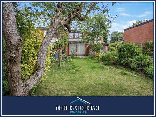 Titelbild - Ruhige Lage: Reihenmittelhaus mit attraktivem Garten sowie Wintergarten und Garage.