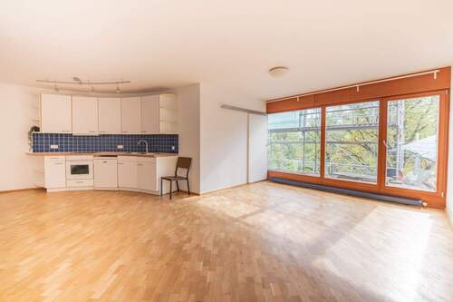 Wohn_Küche - Architektonisches Highlight mit Südterrasse und Ausblick zum Preußenpark: Stilvolle 2-Zimmer-Wohnung