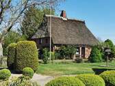 Haus.jpg - Reetdachhaus mit historischem Charme in Krempermoor