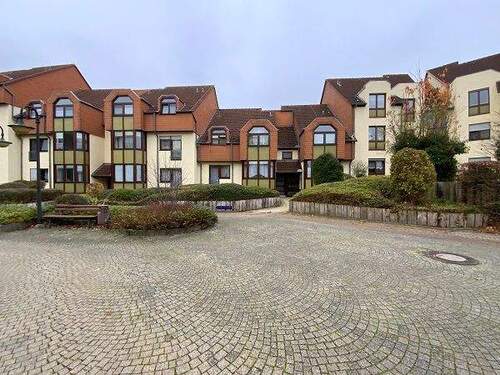 Mehrstöckige Wohngebäude im Käthe-Kollwitz-Weg mit Vorplatz - Gemütliche 3-Zimmer-Wohnung in zentraler Lage