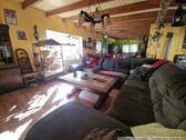 Wohnzimmer mit Blick in die Küche - Einfamilienhaus mit 207,00 m² in Limbach-Oberfrohna zum Kaufen