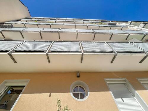 Hausansicht Südseite mit Balkonen - Etagenwohnung mit 76,40 m² in München zum Kaufen