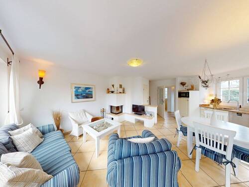 Impression vom Wohnbereich mit Zugang zur Sonnenterrasse im Erdgeschoss - 