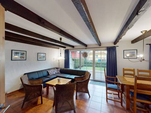 Blick in den Wohnbereich und Zugang zur Sonnenterrasse im Erdgeschoss - Etagenwohnung mit 95,00 m&sup2; in Ostseeheilbad Zingst zum Kaufen