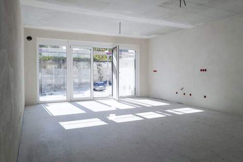 Wohnzimmer - Ihr neues Zuhause mit Garten - moderne 4-Zimmer-Wohnung im Effizienzhaus 40