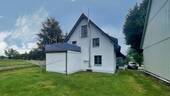 Seitenansicht Haus - 1 Zimmer Mehrfamilienhaus, Wohnhaus zum Kaufen in Ohorn