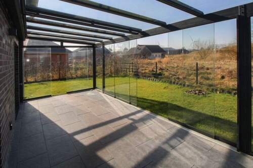 Wintergarten mit Schiebeelementen - Familienoase vor Sylt: Moderne KfW-40 Doppelhaushälfte mit Wintergarten in Klanxbüll