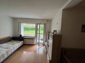 Wohnzimmer mit Blick zur Loggia - 