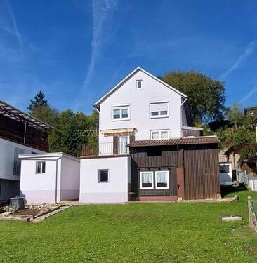 Gartenansicht - Ausbaufähiges Einfamilienhaus mit Garage und großem Grundstück