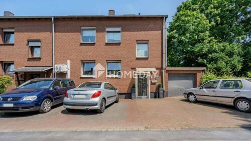 Außenansicht 1 - Vielseitiges Reihenendhaus mit Gartenidylle und 3 Garagen in Duisburg-Süd Ungelshein