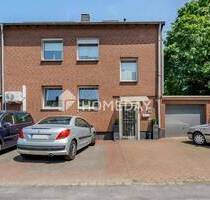Vielseitiges Reihenendhaus mit Gartenidylle und 3 Garagen in Duisburg-Süd Ungelshein
