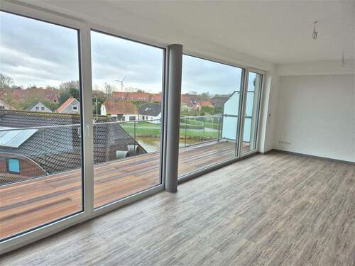 Blick aus dem Wohnzimmer - Schöne Neubauwohnung in zentraler Lage von Carolinensiel - Erstbezug!