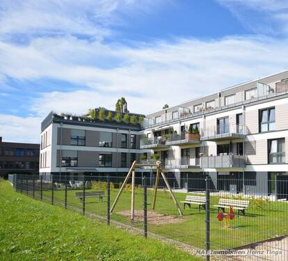 Ansicht Gartenseite klein - Wohlfühlwonhen in Aachen Brand, großzügige 4 Zimmer-Wohnung, Einbauküche, Fußbodenheizung, barierefreier Zugang