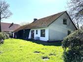 Blick zur Haustür - Einfamilienhaus mit 130,00 m² in Wrohm zum Kaufen