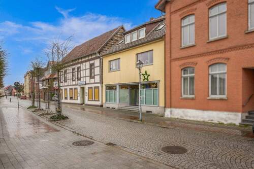 Außenaufnahme - Mehrfamilienhaus, Wohnhaus mit 110,00 m&sup2; in Hoya zum Kaufen