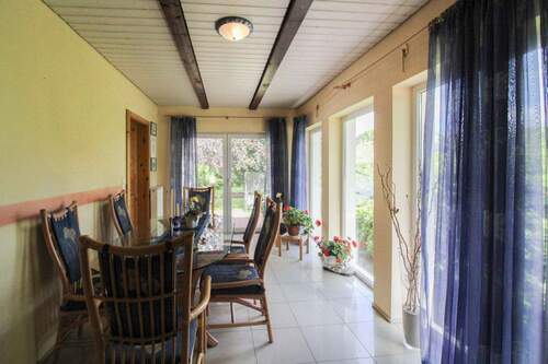 Wintergarten - Einfamilienhaus mit 156,20 m&sup2; in Timmaspe zum Kaufen