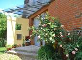 Eingangsüberdachung - 3 Zimmer Einfamilienhaus zum Kaufen in Haseldorf