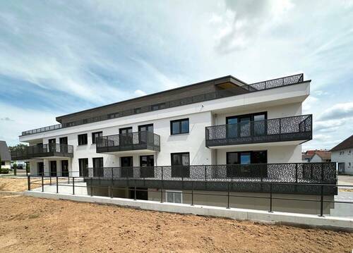Gebäudeansicht 1 Juli - Großzügige 4-Zimmer-Obergeschoss-Wohnung mit ca. 108 m² Wohnfläche - Effizienzhaus 55 nach GEG 2023