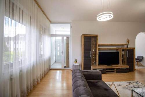 Wohnzimmer EG - Etagenwohnung mit 98,10 m&sup2; in Rutesheim zum Kaufen