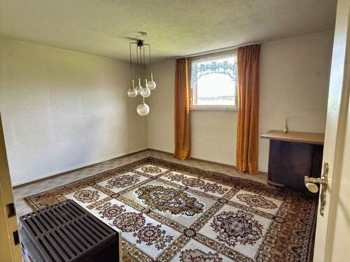 Wohnzimmer mit Kachelofen im DG - 