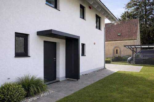 Hausansicht - 1 Zimmer Mehrfamilienhaus, Wohnhaus in Ottobrunn