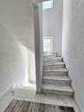 Betontreppe mit Granitstufen ins DG - 