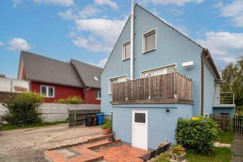 Rückansicht - Sofort wohlfühlen: 4-Zi.-EFH mit sonnigem Garten in guter Lage