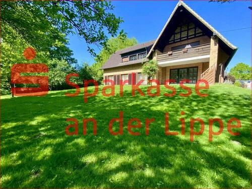 Hausansicht Gartenseite - Werne-Stockum: Zweifamilienhaus aufgeteilt in 2 ETW mit ca. 2.500 m² großem Grundstück