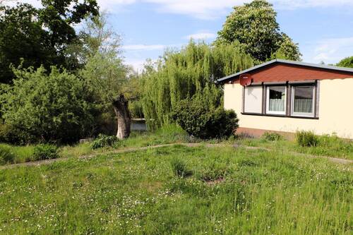 Teich und Ferienhaus - 1 Zimmer Einfamilienhaus in Havelberg