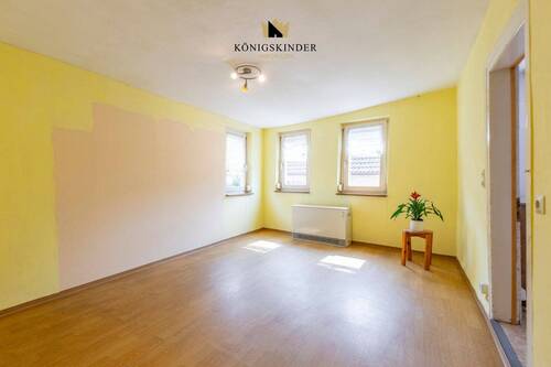 1.OG Wohnzimmer- Wärme und Gemütlichkeit: Das Herzstück des Hauses - 